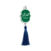 A green and blue tassel bookmark featuring the word "Quran" prominently displayed.