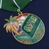 Medaglia personalizzata dell'Arabia Saudita con la bandiera araba e il disegno di una palma.