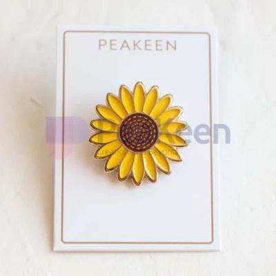 Custom sunflower pin featuring a vibrant design, perfect for adding a touch of nature-inspired charm to any outfit.