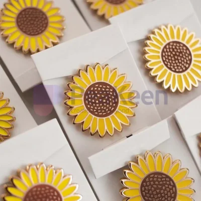 Custom sunflower pin featuring a vibrant design, perfect for adding a touch of nature-inspired charm to any outfit.