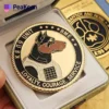 A proud dog wearing a K9 coin medal, sitting inside a decorative box, showcasing its achievement and charm.