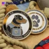 A K9 coin and dog badge displayed together, showcasing their unique designs and significance in canine service recognition.