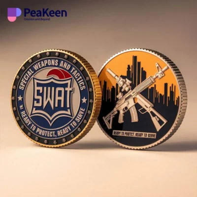 Two distinct SWAT challenge coins featuring the word "SWAT" prominently displayed on each coin.