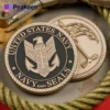 US Navy SEAL challenge coin featuring the emblem and motto, symbolizing honor and commitment to service.