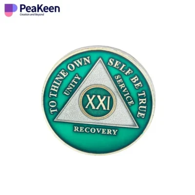 A green and white coin featuring the word "Recovery," symbolizing support from Alcoholics Anonymous.