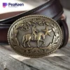 Brass belt buckle featuring a cowboy riding a horse, showcasing intricate detailing and craftsmanship.