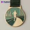 A gold medal featuring a runner, symbolizing achievement in cross country events.