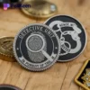 A detective challenge coin featuring a badge design and a fingerprint emblem, symbolizing law enforcement and investigation.