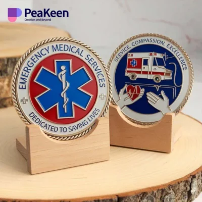 Two emergency medical service badges displayed on wooden stands, showcasing the ems challenge coin design.