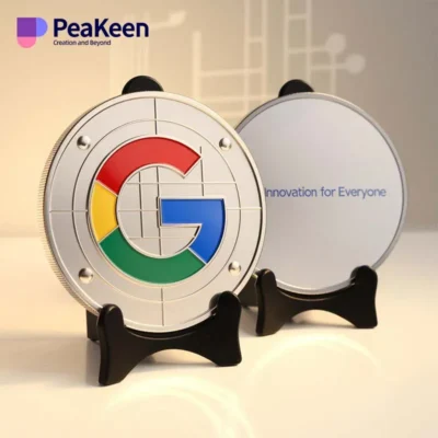 Google logo displayed on a metal plate with a stand, resembling a commemorative coin design.