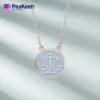 A soft enamel Libra necklace featuring the symbol of justice, elegantly designed for a stylish and meaningful accessory.
