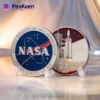 Commemorative NASA space shuttle mission coin featuring intricate designs and the NASA logo, symbolizing space exploration.