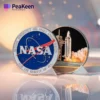 Commemorative NASA space shuttle launch coin featuring intricate designs and the iconic NASA logo.