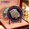 A close-up of a high-stakes poker coin encased, highlighting its detailed craftsmanship and significance in the game.
