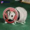 A poker playing card coin resting on a table, showcasing its design and reflecting the essence of the game.