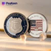 Two police challenge coins featuring the words "Protect" and "Serve" prominently displayed on their surfaces.
