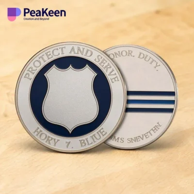 Two police challenge coins featuring badges with the words "Protect" and "Serve" prominently displayed on them.