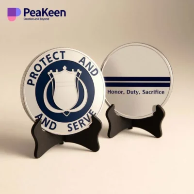 Two metal badges featuring the phrases "Protect" and "Serve," representing a police challenge coin.