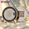 Two police challenge coins featuring the words "Protect" and "Defend" prominently displayed on their surfaces.