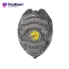 A collection of customized police enamel badges displayed in a neat arrangement, showcasing various designs and colors.