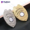 Two police enamel badges displaying the words "Security" and "Protection" prominently featured on each badge.