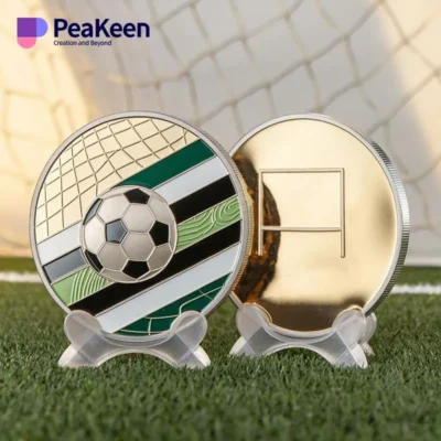 A soccer ball and a coin are placed on a table, showcasing a unique soccer-themed coin alongside the ball.