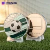 A soccer ball and a soccer-themed coin resting on a grassy field, symbolizing the sport's excitement and value.