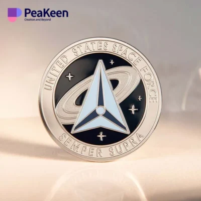 US Space Force logo displayed on a silver challenge coin, symbolizing commitment to space operations and defense.