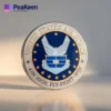 The US Air Force high-flyer coin displayed prominently, featuring unique squadron symbols and a polished finish.