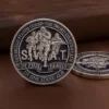 Engraved challenge coin displaying the phrase "smart in this family" for the SWAT team.