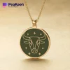 A gold-plated necklace featuring a soft enamel Taurus bull design, showcasing elegance and zodiac symbolism.