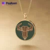 A gold-plated necklace featuring a soft enamel Taurus bull design, showcasing elegance and zodiac symbolism.