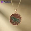 Elegant gold-plated necklace showcasing a bull, made with soft enamel, representing the Taurus astrological sign.