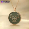 A gold-plated necklace featuring a soft enamel Taurus bull design, showcasing elegance and zodiac symbolism.