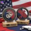 A collection of USMC challenge coins displayed together, showcasing their unique designs and military significance.