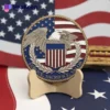 A metal veterans challenge coin featuring the US flag and an eagle design, symbolizing patriotism and honor.