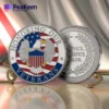 A metal challenge coin featuring the inscription "Honoring Our Veterans" to commemorate their service and sacrifice.