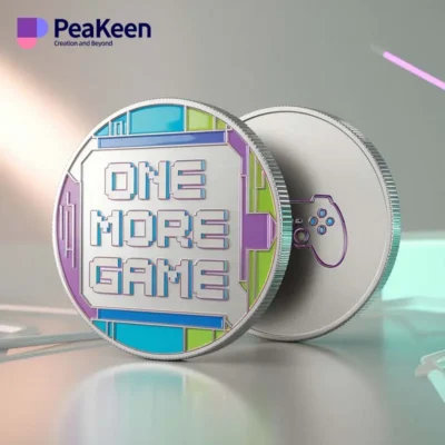 A detailed view of a collectible video game challenge coin labeled "Peakeen One More Game."