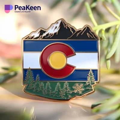 Colorado flag pin featuring mountains and trees, symbolizing the state's natural beauty and pride.