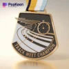 Medal inscribed with "Track Meet Champion," awarded for outstanding performance in track competitions.
