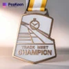 A medal featuring the words "Track Meet Champion," representing achievement in athletic events.