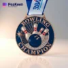 A shiny medal inscribed with "Bowling Champion," symbolizing victory in bowling competitions.