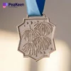 Cheerleading medal showcasing the word "peakeen" symbolizing achievement in the sport.