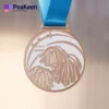 A cheerleading medal adorned with a blue ribbon, representing success and dedication in cheerleading competitions.