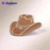 Alfiler de sombrero vaquero marrón sobre un fondo blanco limpio, que muestra su detallado diseño y artesanía.