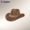 Un sombrero de vaquero marrón que destaca sobre un fondo blanco limpio, con un alfiler de sombrero de vaquero decorativo.
