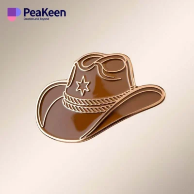 Brown cowboy hat pin displayed on a clean white background, showcasing its detailed design and craftsmanship.