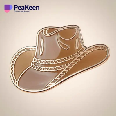 Cowboy hat pin displayed on a white background, showcasing its design and details.