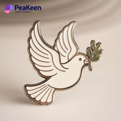 A white dove pin holding an olive branch, symbolizing peace and hope, elegantly displayed against a neutral background.