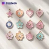 A collection of colorful enamel peakeen charms featuring various unique designs displayed together.